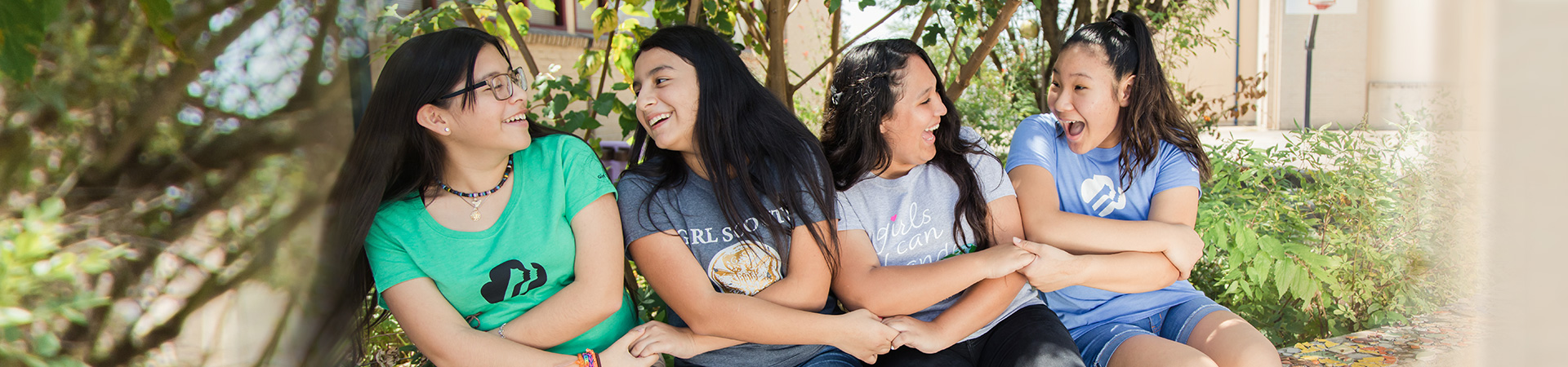  Girls laughing and holding hands 